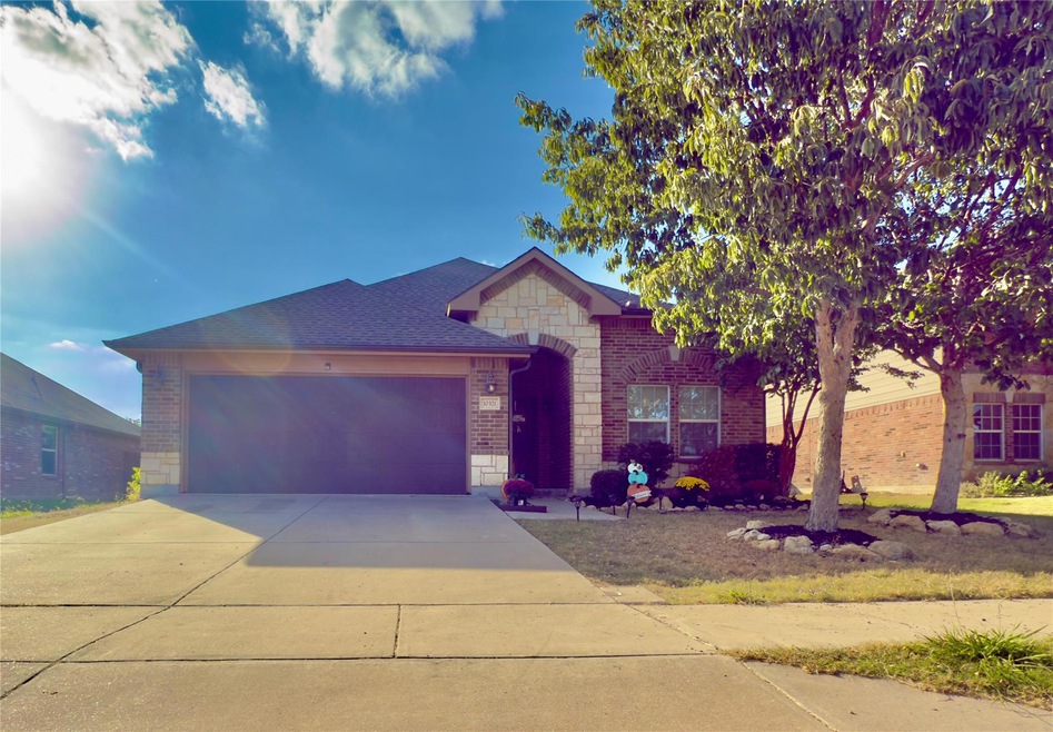 View of front of home featuring a garage