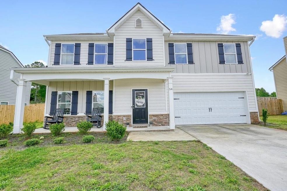 View of front of property with board and batten si