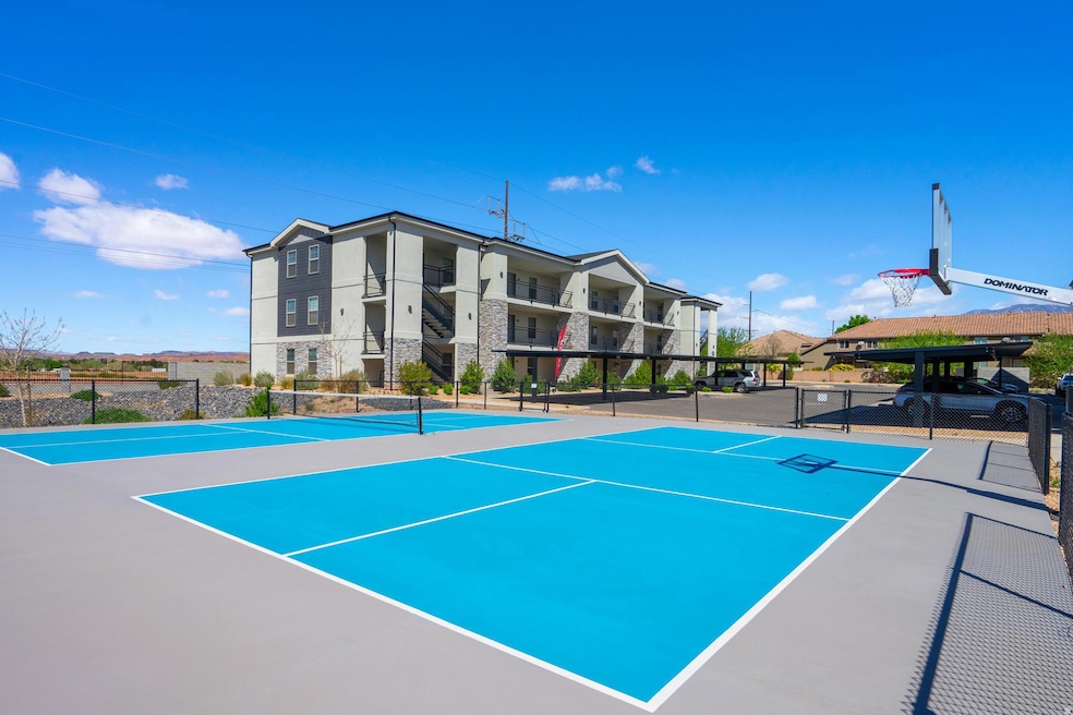 View of tennis court featuring community basketball court