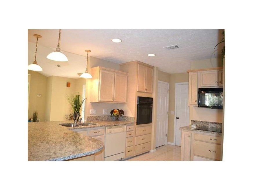Kitchen. Inviting kitchen offers granite counterto
