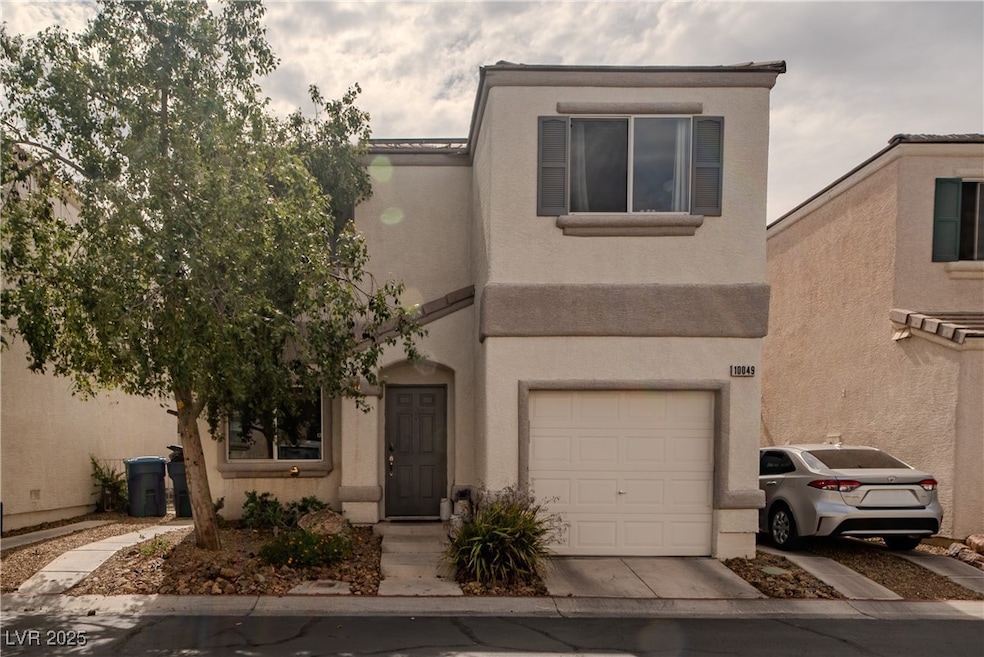 View of front facade featuring an attached garage,
