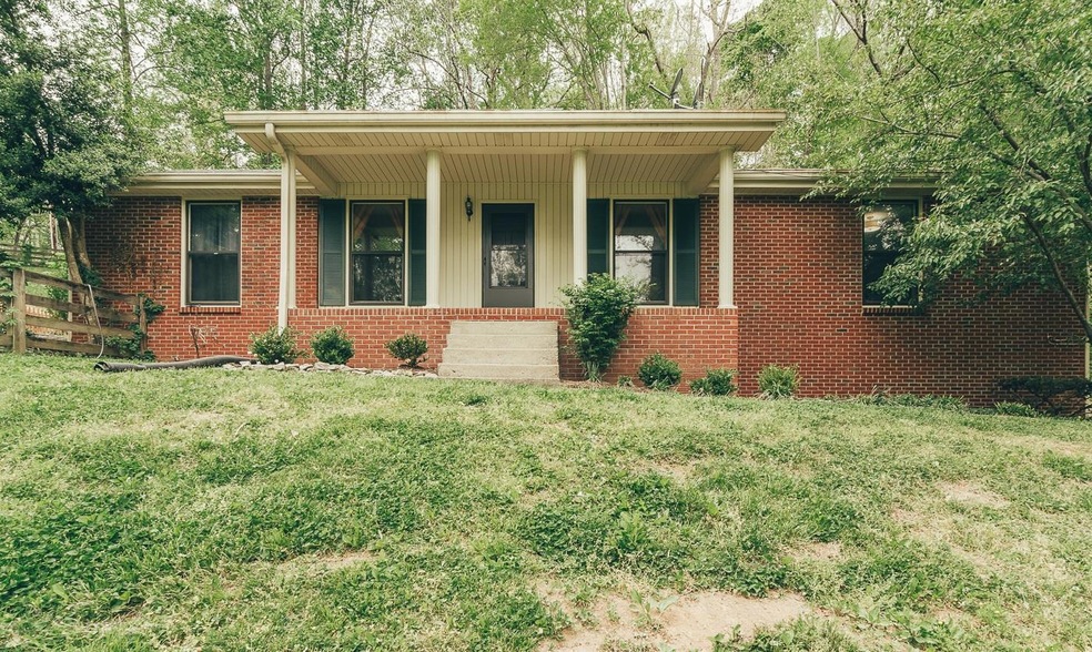 Hilltop Haven on 1.5 Acres with a salt water in-ground pool and a hot tub.  Recently remodeled kitchen and baths.  
