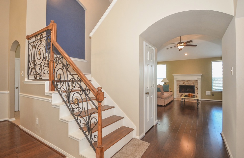 Upgraded wrought iron railing.  Can you imagine the wall art possibilities on the picture wall that you see at the first landing of the winding stairs!