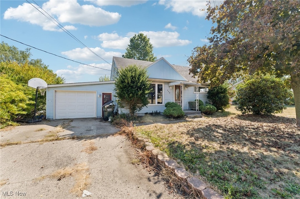 Ranch-style home with driveway and a garage