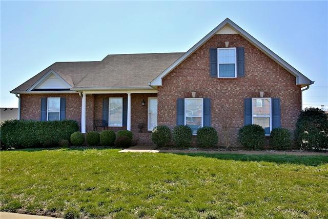 Beautiful Curb appeal with lovely front porch, side entry garage, sidewalks, brick mailbox and mature landscaping.