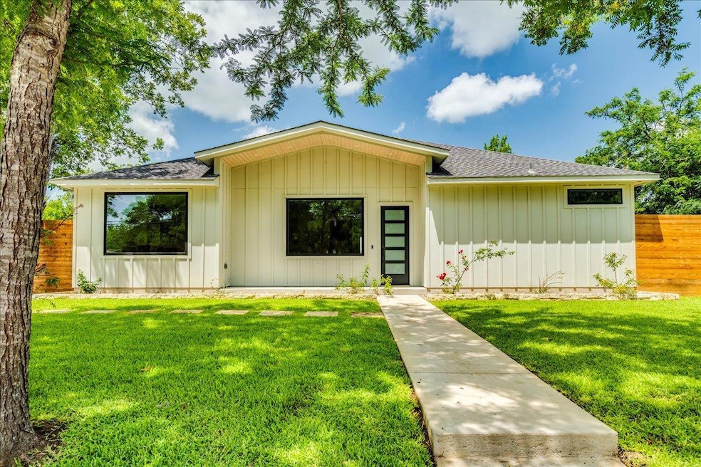 View of front of home featuring roof with shingle