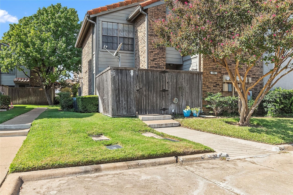 View of side of home with a yard