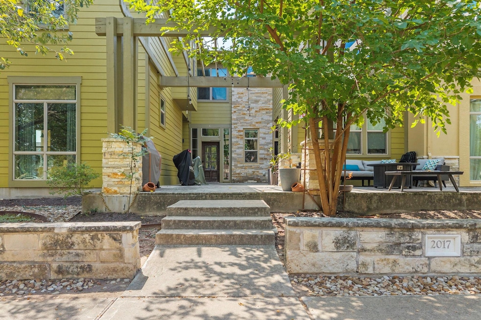 Doorway to property with a patio area and stone siding