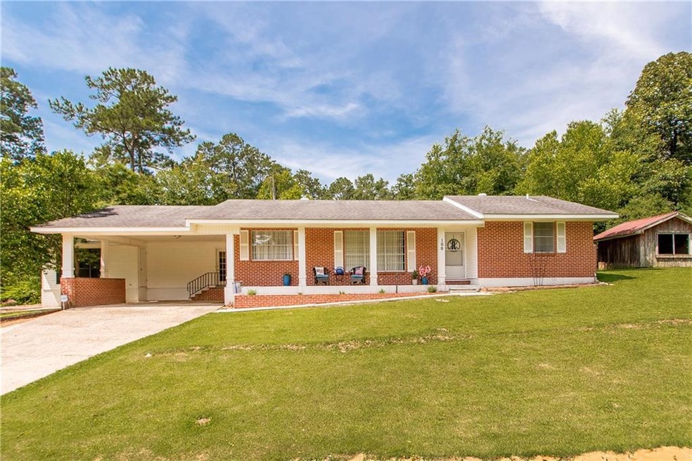 Front of house with carport and front porch