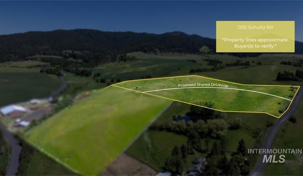 View of rural area with a mountainous background and property boundaries highlighted