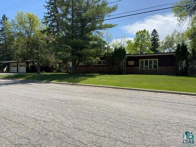 View of front of home featuring a front lawn