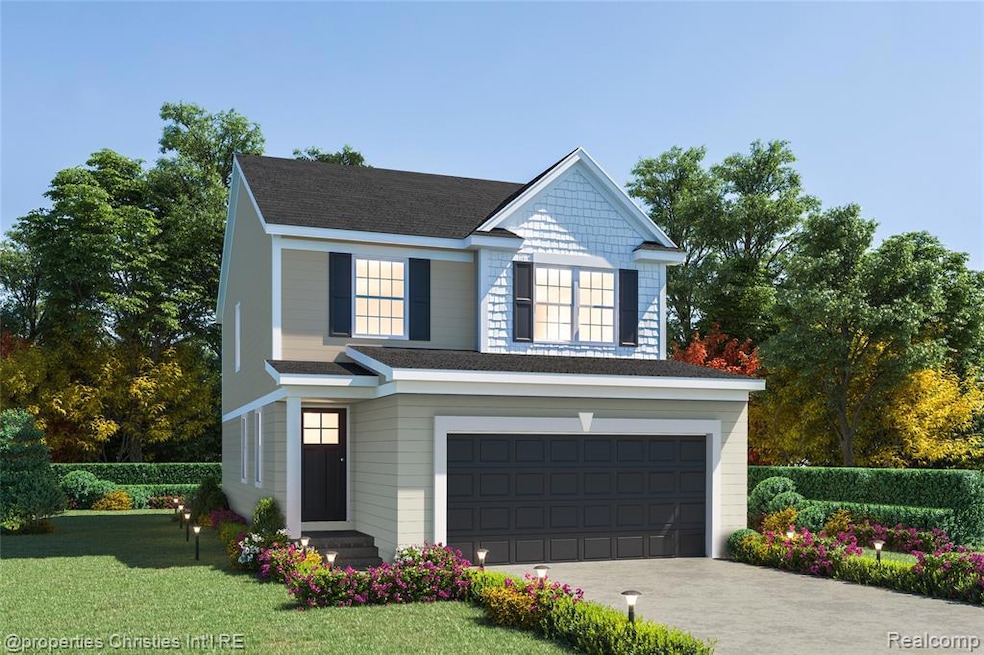 View of front of house with a garage, driveway, a front lawn, and roof with shingles