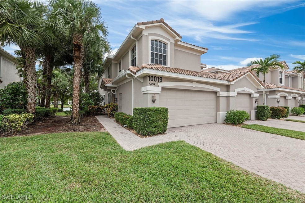 Mediterranean / spanish-style house featuring a ga