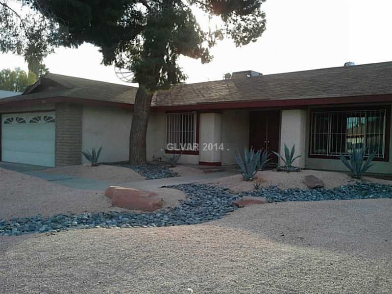 Property Photo. Front of the house with mature tre