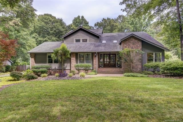 Front of home with charming architecture and matur