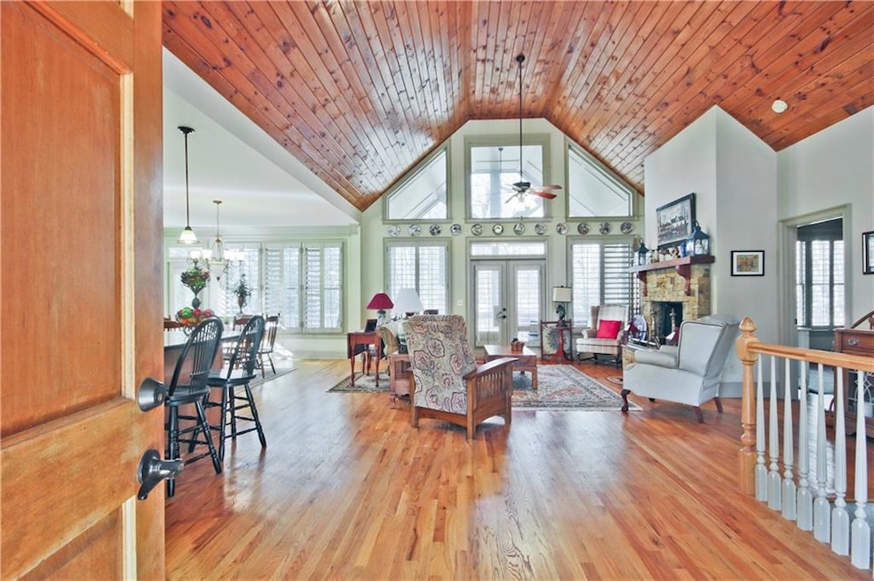 Welcome home....beautiful wood floors and ceiling.