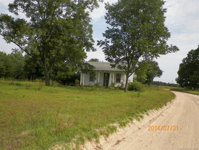 House located on 8+- acre parcel in need of repair