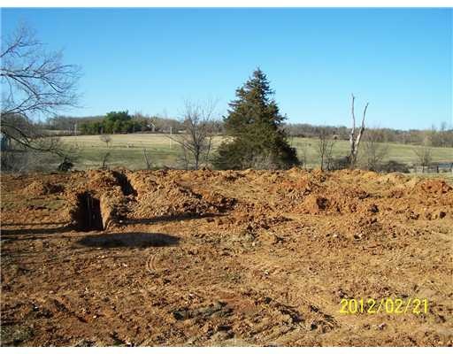 Exterior Front. Land looks similar to subject