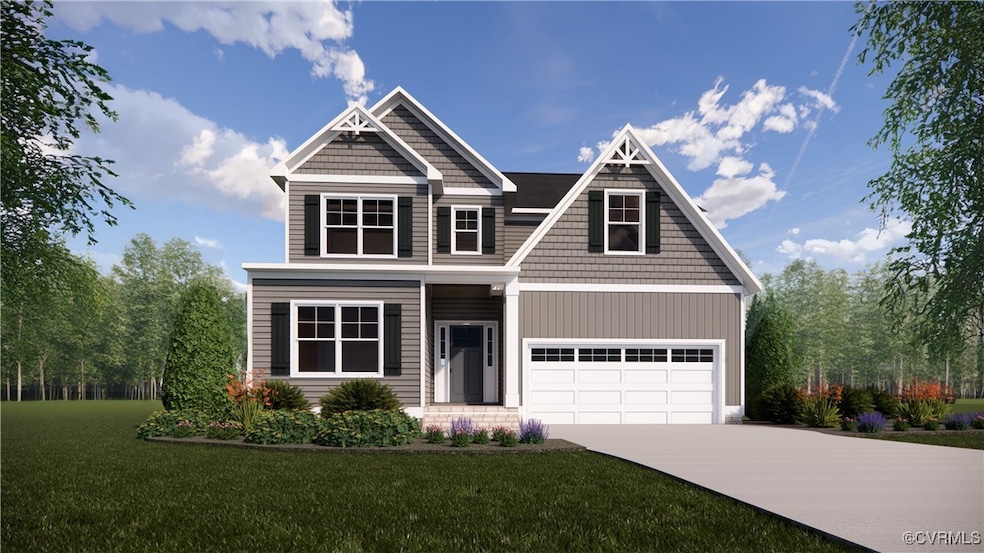 Craftsman-style home with driveway and a front law