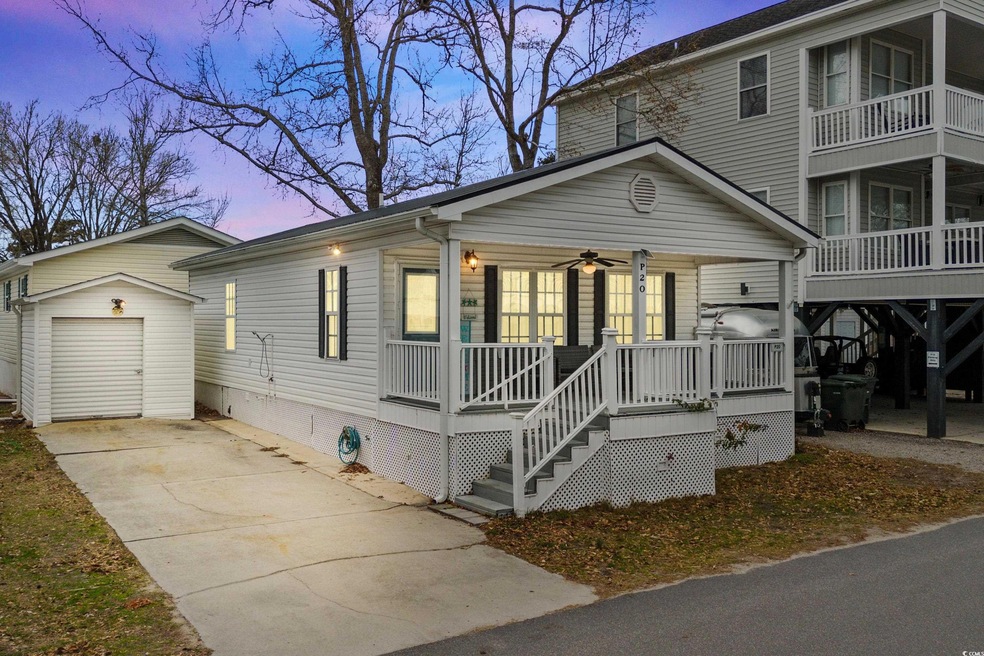 View of front of home featuring covered porch, cei