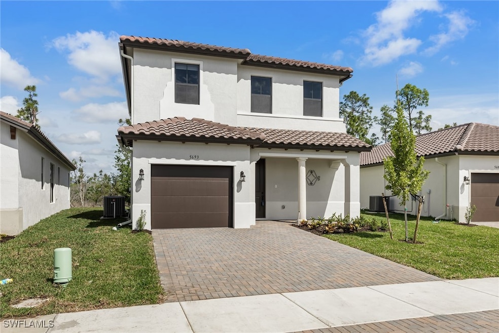 Mediterranean / spanish house featuring a garage,