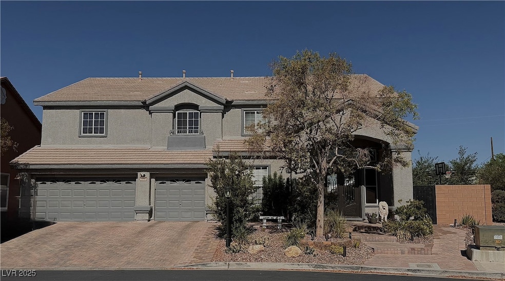 View of front facade with decorative driveway, an
