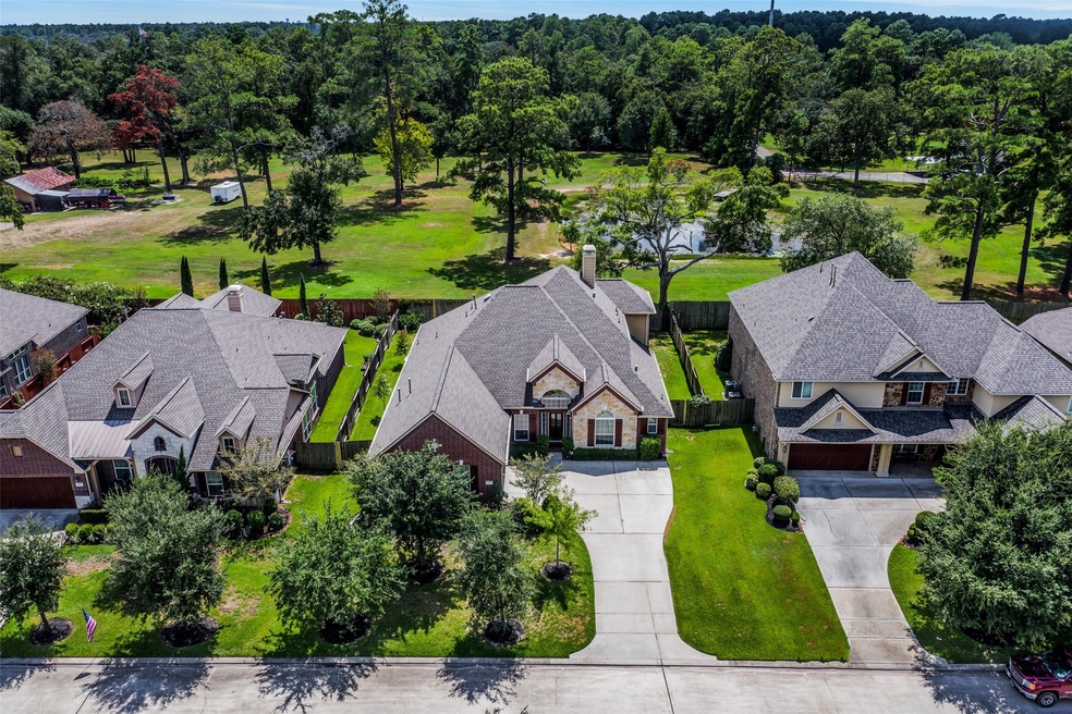 Welcome to this beautiful, well kept and spacious 1.5 story home with stone & brick exterior nestled in the quiet, gated-community of Treeline. Never flooded! Floor plan boasts high ceilings and great natural light and plenty of space for the formal living and separate study! Crown molding throughout! Low-E Double Insulated Windows. Flex room/media room/game room on the 3,381 sf with 4 bedrooms (3 down), 3 baths, and a 2 car garage backing to private acreage for a more peaceful experience!