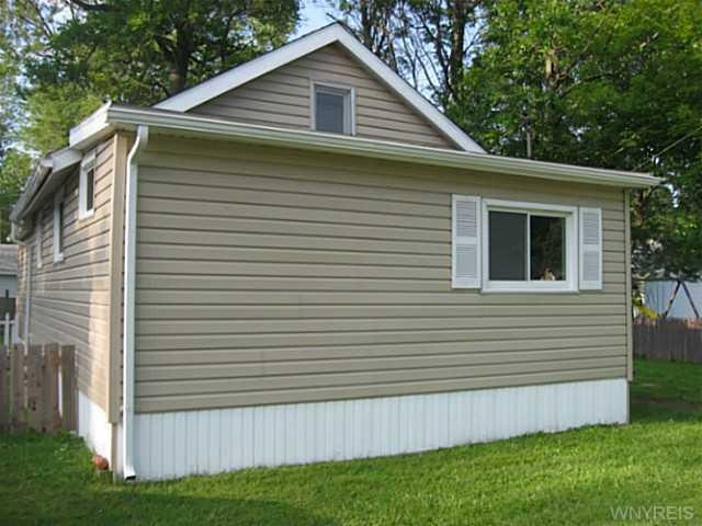 Exterior Front. New roof, siding, gutters and soff