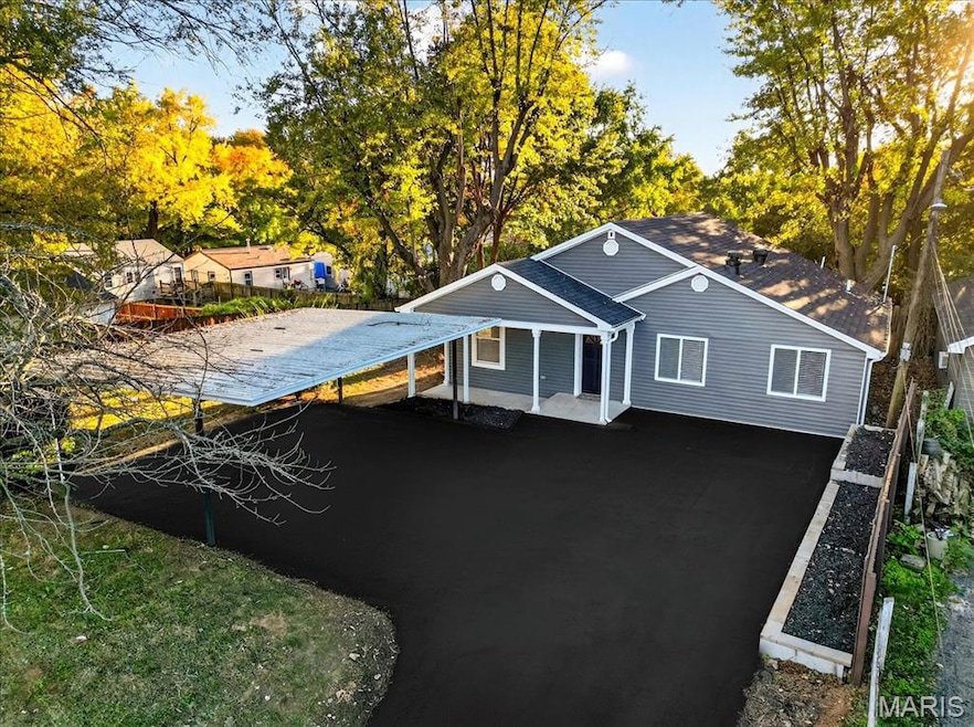 View of front of property with roof with shingles
