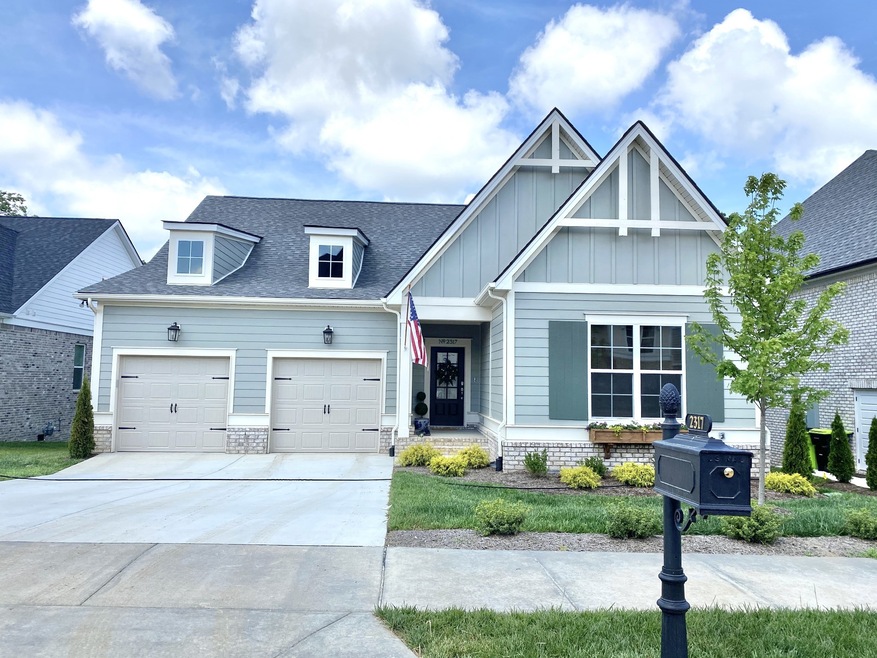 Beautiful separate garage doors, classic construction, private mailbox, covered stoop... Welcome Home!