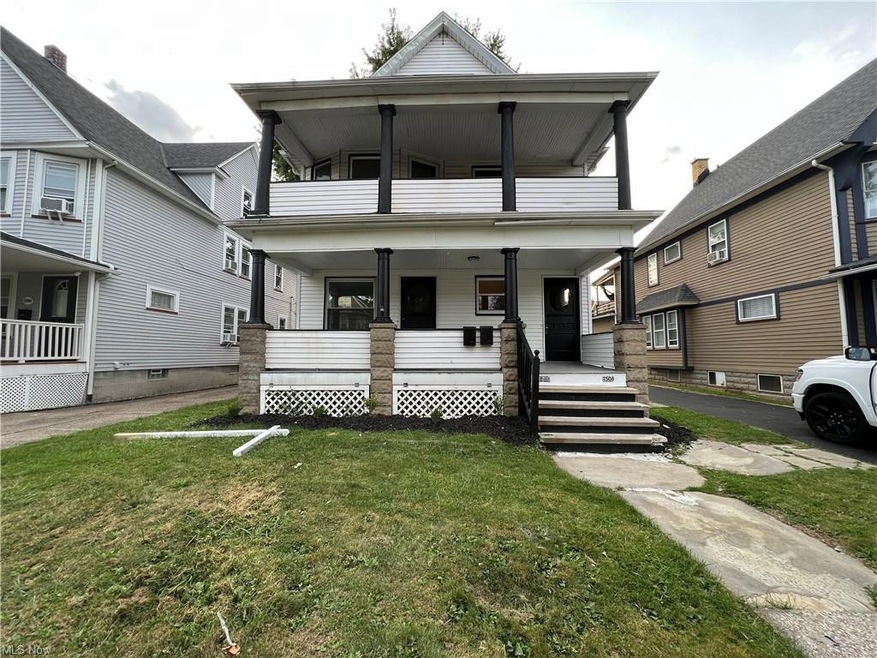 View of front facade with a front yard and a porch