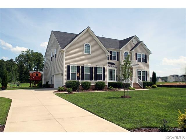 Two car side entry garage with double width cement driveway