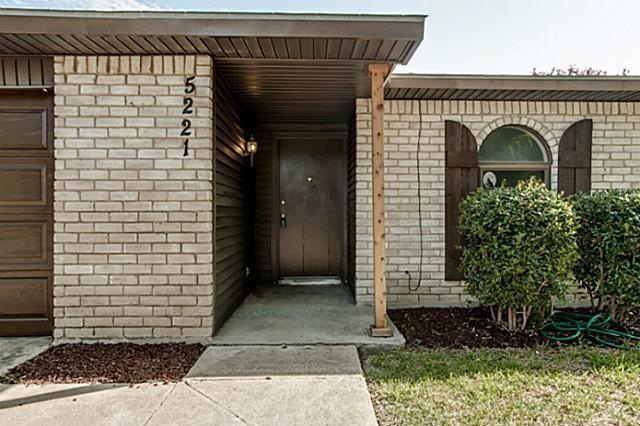 Property entrance featuring a garage