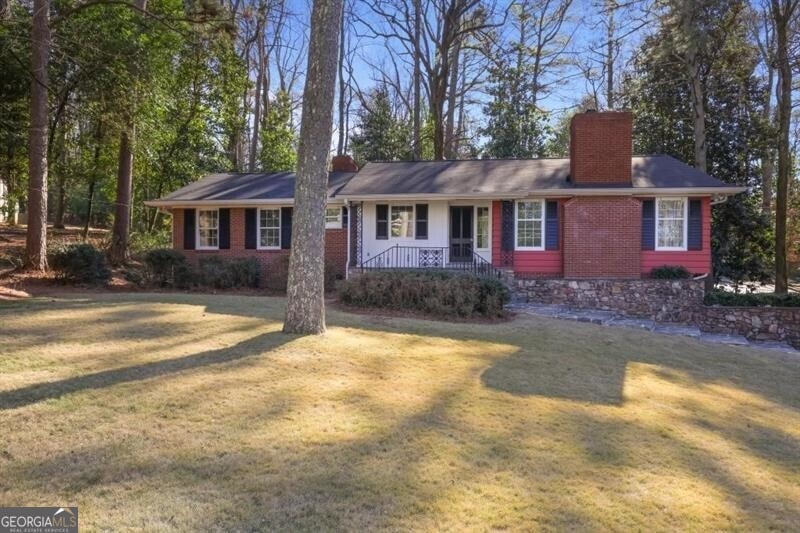 Ranch-style house with covered porch and a front l