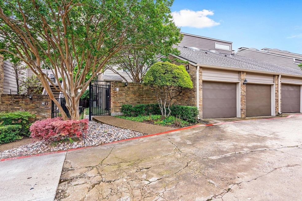 View of front of condo with a garage