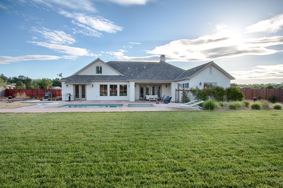 Large yard with covered patio