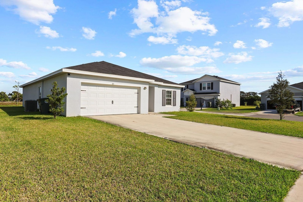 185 Dabou Loop, Belle Glade, FL 33430 - photo 1