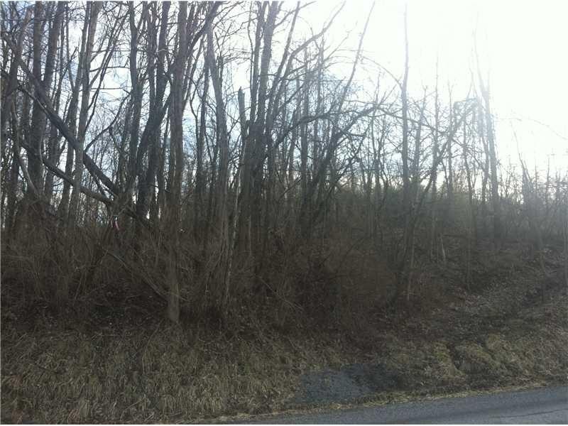Exterior Front. Lot from street.  Sloping upward