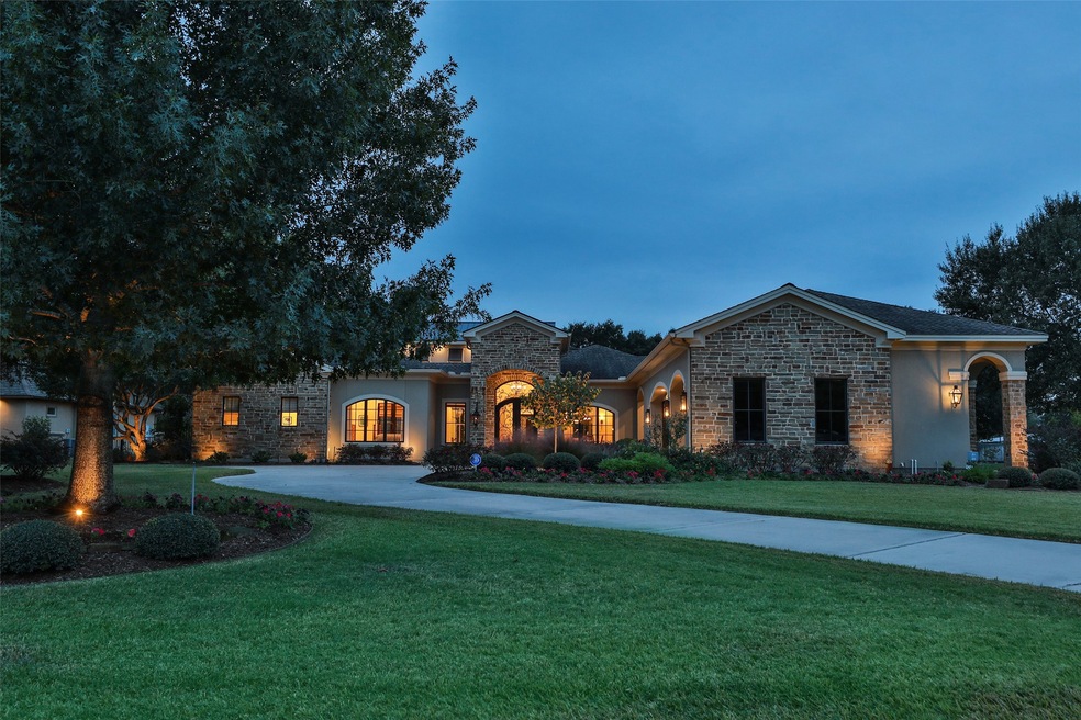 Exquisite custom home located on an acre in private enclave of Great Oaks Estates.