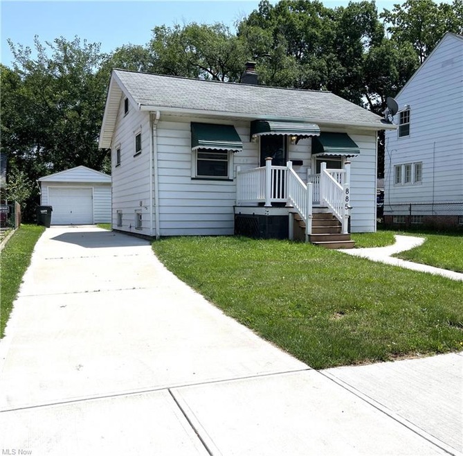 Front of home with new driveway and walkway