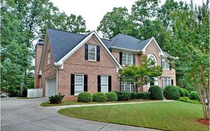 Exterior Front. 3 1/2 sides brick with side entry 
