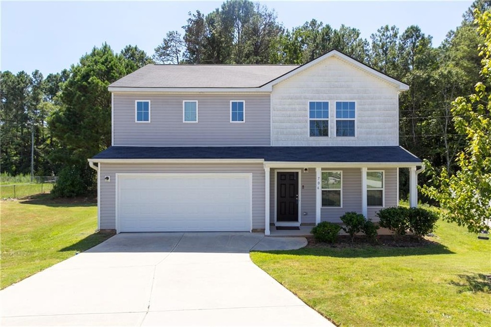 View of front of house featuring a garage and a fr