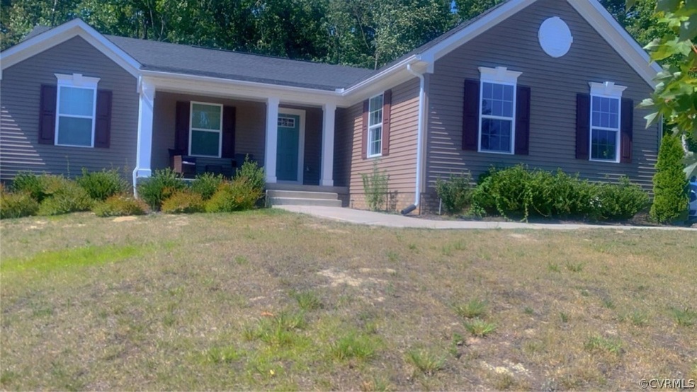 View of front of house with a front lawn and covered porch