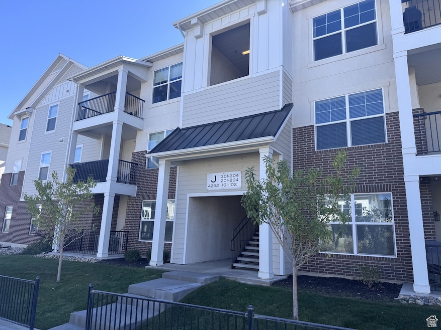 View of apartment building / complex with stairs