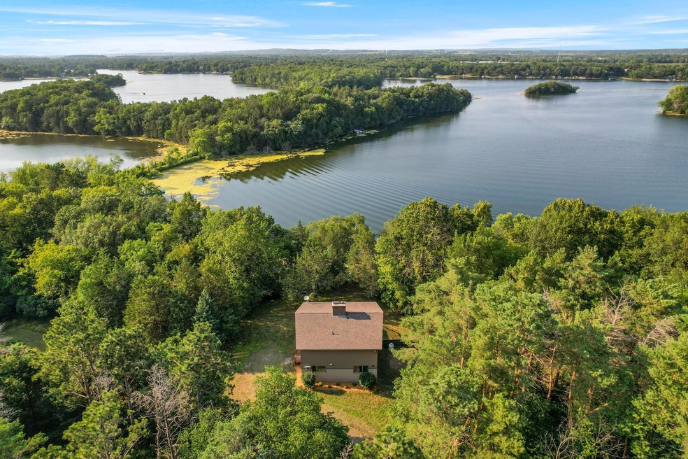 Unbelievable opportunity for a year-round home on a 2-acre heavily wooded lot located on the highly desired Cedar Island Lake! Offers 200-feet of shoreline and so much more!