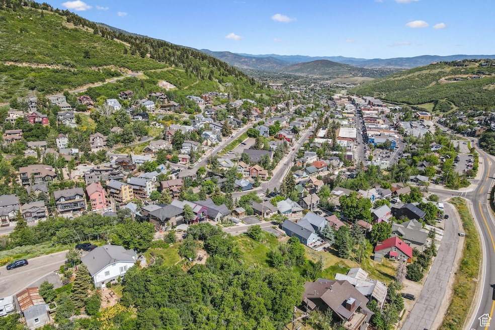 Aerial view of property's location with nearby suburban area