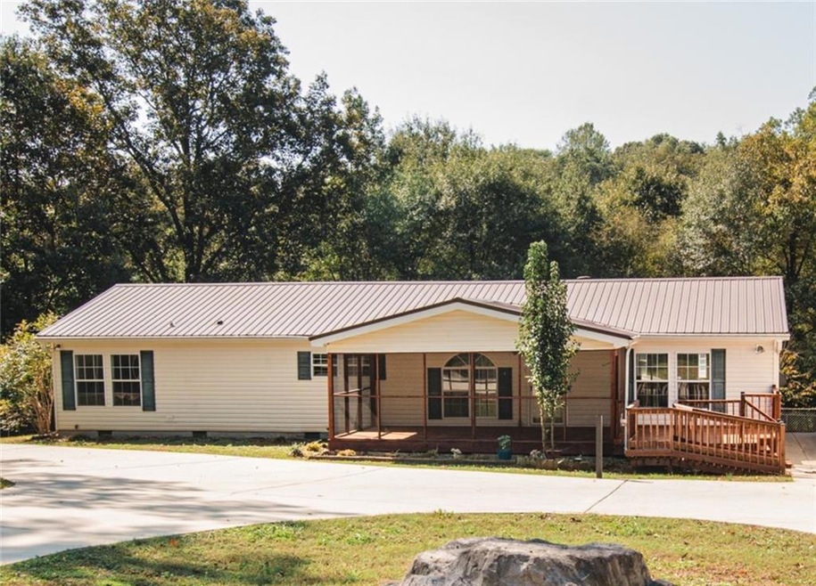 Ranch-style house with a deck, crawl space, concre