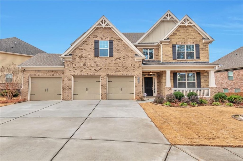 Craftsman-style house featuring a porch and a gara