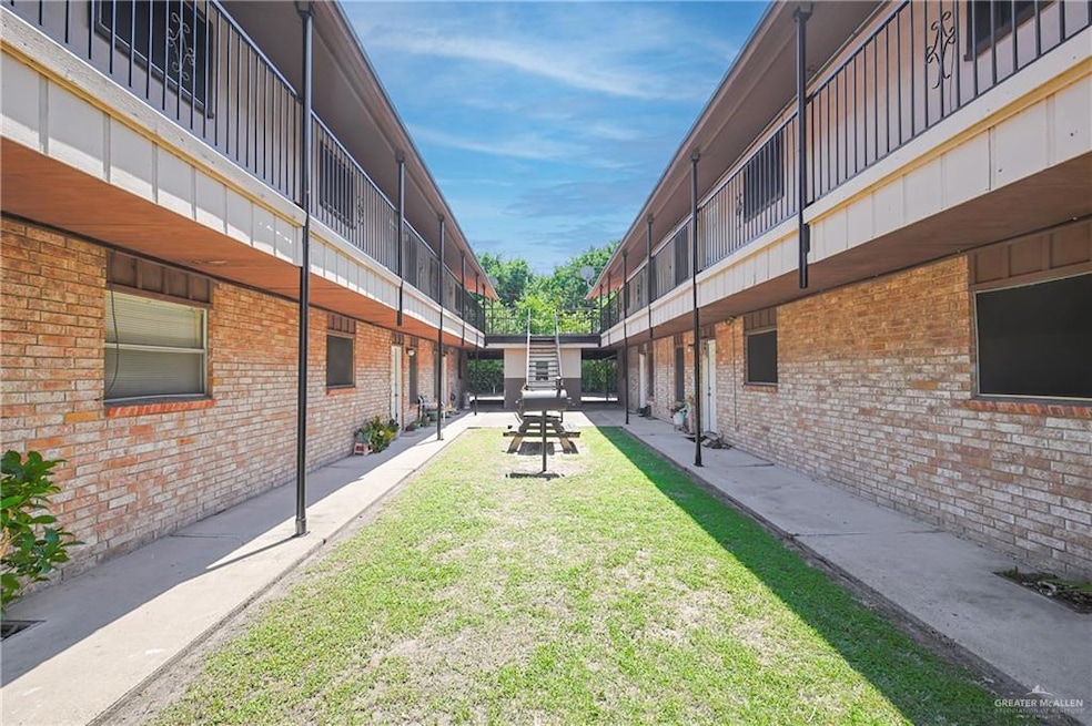 View of home's community with a yard