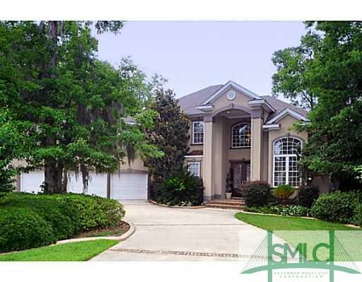 Exterior Front. This stately stucco home is nestle
